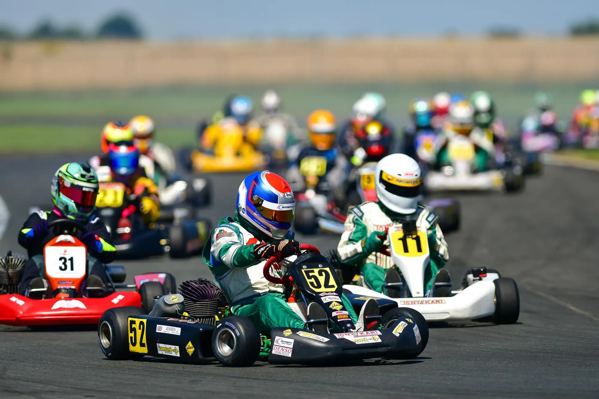 Jacques Jensen #52 leading F100 Formula A kart pack on track